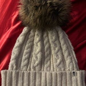 The North Face Cream Cable Knit Beanie with Brown Pom